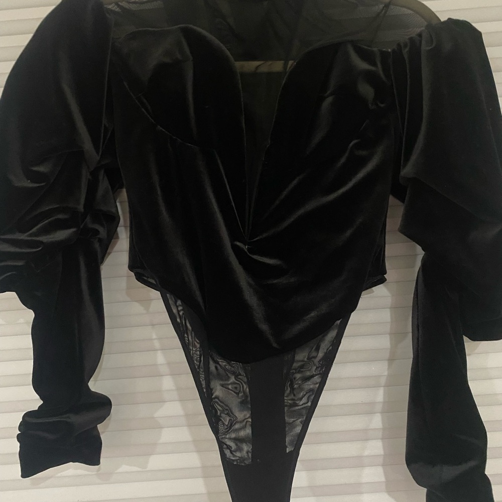 A black top body suit house of cb